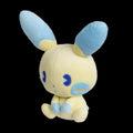 Plush toy with blue ears and feet on a white background