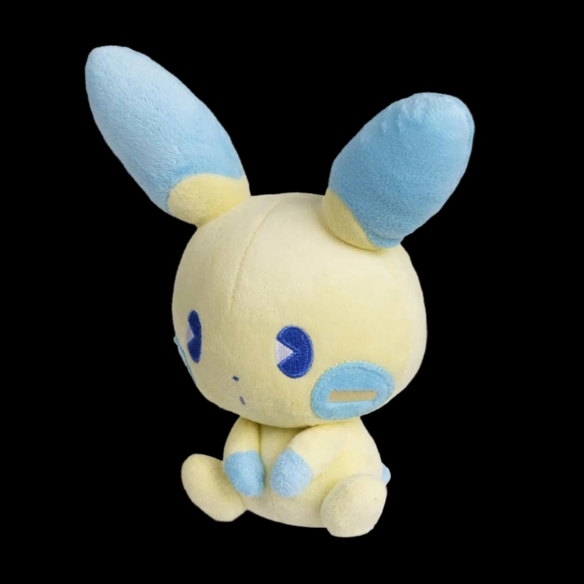 Plush toy with blue ears and feet on a white background